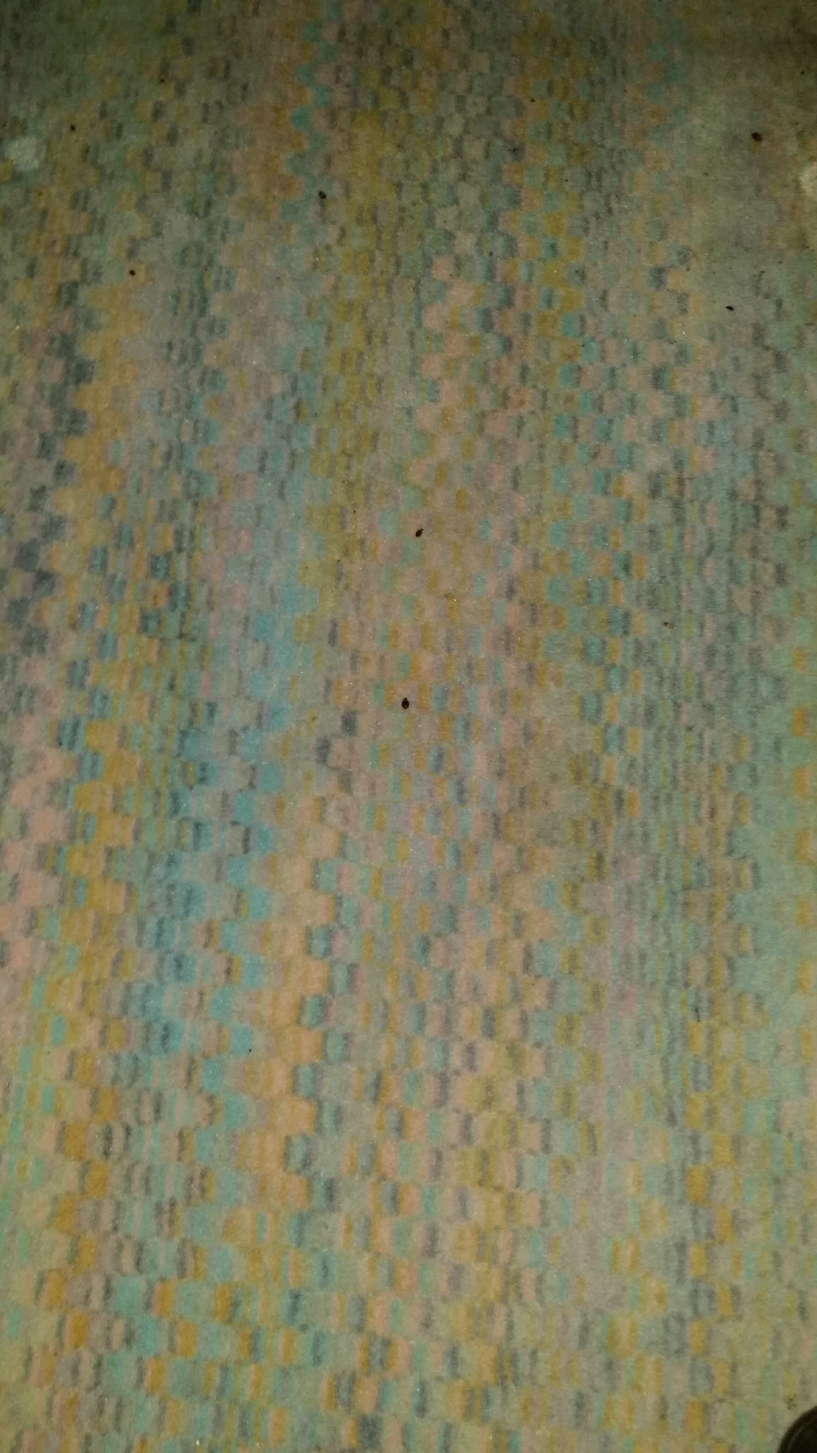 Détail d’un textile examiné pendant une inspection